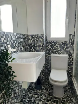 a bathroom with a tub and a toilet and a sink at SingularStays Valero III in Valencia