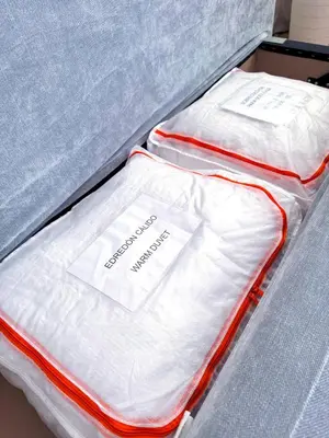 a bed with white sheets on top of it at Studio Aiora in Valencia