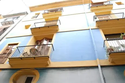 a building with balconies on the side of it at Loft con estilo y terraza en centro histórico in Valencia
