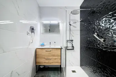 a white bathroom with a sink and a shower at Precioso Loft Sorolla en Playa Malvarrosa/Patacona in Valencia