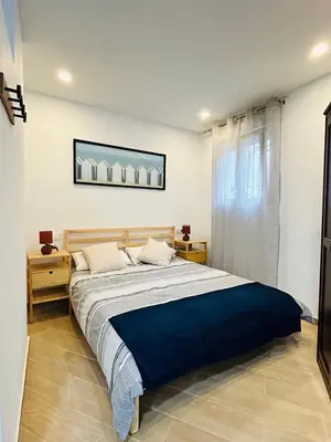 a bedroom with a large bed in a room at Patraix nice suite in Valencia