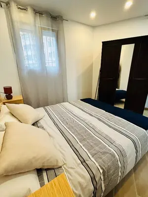 a large bed in a bedroom with a window at Patraix nice suite in Valencia