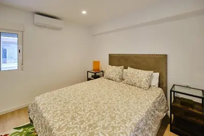 a bedroom with a bed and a window at REINA FLAT in Valencia