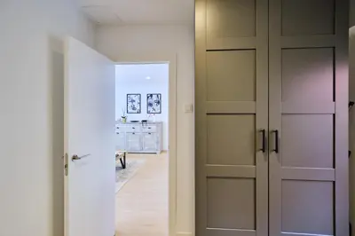 a room with two doors and a room with a hallway at REINA FLAT in Valencia