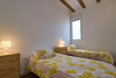 a bedroom with two beds and a window at Apartamento minimalista en Matemático Marzal in Valencia