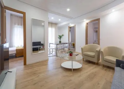 a living room with a couch and a table at Furio Silence in Valencia