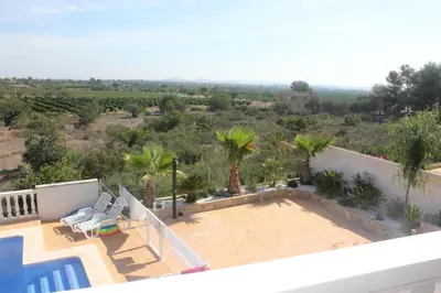 a view from the balcony of a house with a swimming pool at Sierra de Chiva Villa in Chiva