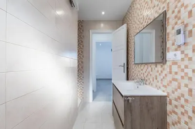 a bathroom with a sink and a mirror at Placid Puerto in Puerto de Sagunto