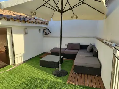 a large room with two beds and a staircase at Ca La Perla in Albalat de Taronchers