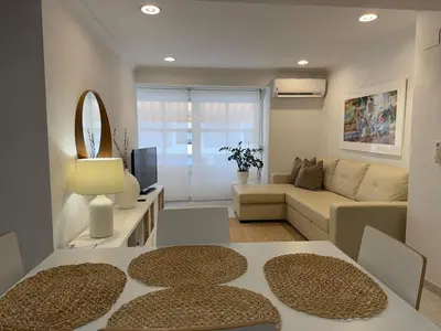 a living room with a couch and a table at Encanto exclusivo en pleno centro de Valencia in Valencia