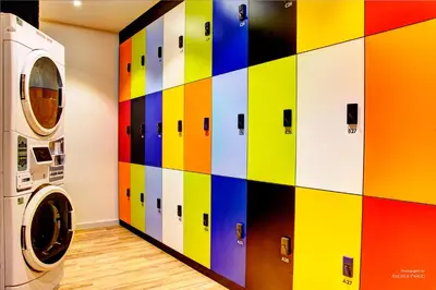 a colorful wall in a laundry room with a washing machine at Urban Youth Hostel in Valencia