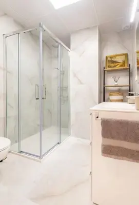 a white bathroom with a shower and a toilet at Apartamento Exclusivo en Valencia in Valencia