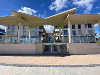 a large white building with a roof at Stylish Apartment with Terrace on the BeachFrom in Valencia