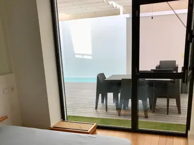 a dining room with a table and a view of the ocean at Apartment Loft Villalonga by Interhome in Valencia