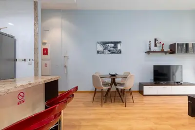 a kitchen with a table and chairs in a room at Patacona Mediterranean Beach in Valencia