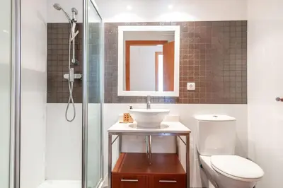 a bathroom with a sink and a toilet and a shower at Burriana Beach Retreat: Pool & Comfort in Burriana