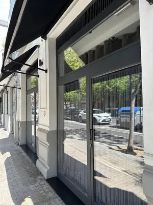 a pair of glass doors on a building at Magnifica vivienda a estrenar junto a Plaza España in Valencia