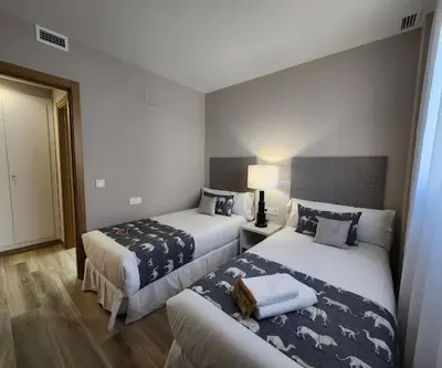 a hotel room with two beds and a lamp at MD Pont de Fusta in Valencia