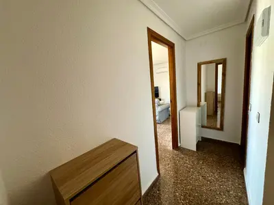 a room with a hallway with a mirror and a table at Your Long Stay Attic Home in Valencia in Valencia