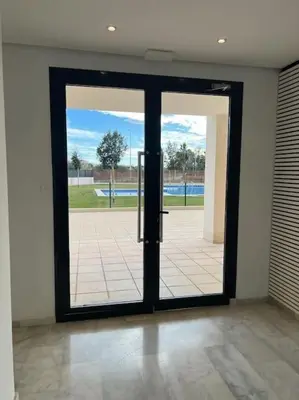 an open door with a view of a pool at Apartamento en Playa moncófar a tan solo 300 metros in Moncófar