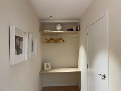 a room with a closet with a shelf and a door at Osito Hub - Pintor Nicolau in Valencia