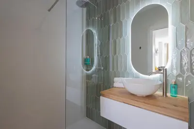 a bathroom with a sink and a mirror at FLORIT FLATS - Stylish Studio by the Joaquin Sorolla Station in Valencia