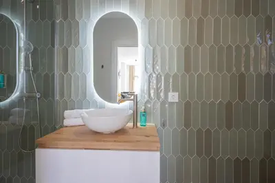 a bathroom with a sink and a mirror at FLORIT FLATS - Stylish Studio by the Joaquin Sorolla Station in Valencia