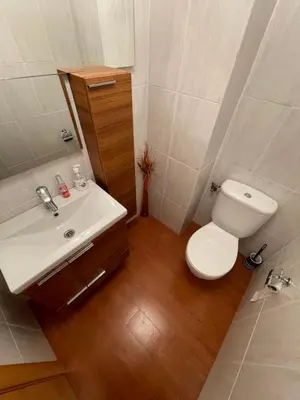 a bathroom with a white toilet and a sink at Bungalow on the beach 15 minutes from Valencia in Valencia