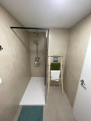 a walk in shower in a bathroom with a door at Mar&Sol Flats by Vivo GC in Valencia