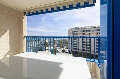a view of a balcony with a table and chairs at ApartUP Patacona Infinity in Valencia