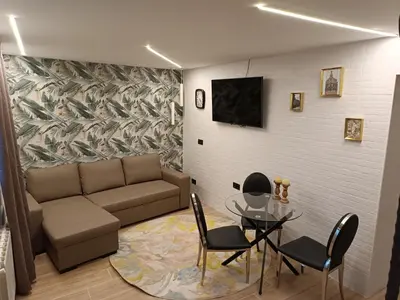a living room with a couch and a table and chairs at loft Gilet 20 km Valencia montaña Senderismo Bici in Gilet