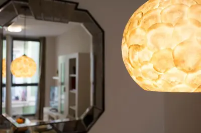 a mirror on a wall next to a mirrorasteryasteryasteryasteryasteryasteryastery at SingularStays Comedias in Valencia