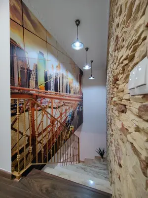 a staircase with a painting on the wall at Casona Torrent in Torrent