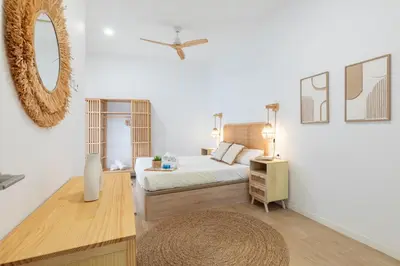 a bedroom with a bed and a mirror on the wall at Travel Habitat Zaidia con Terraza in Valencia