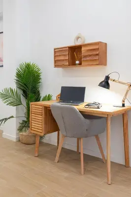 a desk with a chair and a laptop on it at Travel Habitat Zaidia con Terraza in Valencia