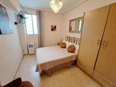 a bedroom with a bed with two pillows on it at Apartamento exterior de tres habitaciones in Valencia