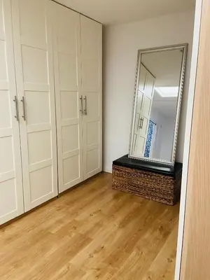 a room with white cabinets and a mirror at VILLA FALI in Benaguacil