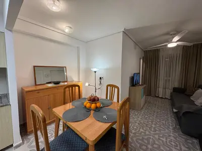 a living room with a table with fruit on it at Apartamento en Cullera in Cullera