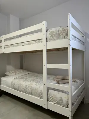 two white bunk beds in a room at UIM Mediterraneo PB Cendoya 1 wifi in Puerto de Sagunto
