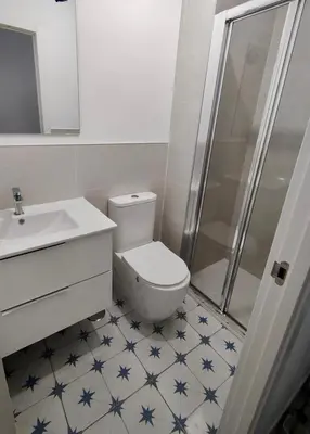 a bathroom with a toilet and a sink and a shower at SuecaRoom Prime Experience in Sueca