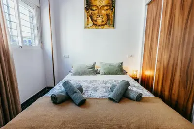 a bedroom with a bed with two pillows on it at Casa Pancho, ChillOut, Oceanographic, City of Arts in Valencia