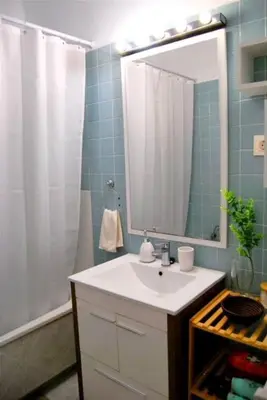 a bathroom with a sink and a shower with a mirror at Habitación céntrica in Valencia