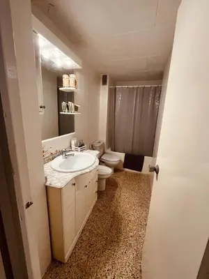 a bathroom with a sink and a toilet at El Molino Buñol Apartamento in Buñol
