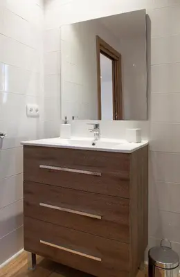 a bathroom with a sink and a mirror at Mar de fonts ain in Ahín