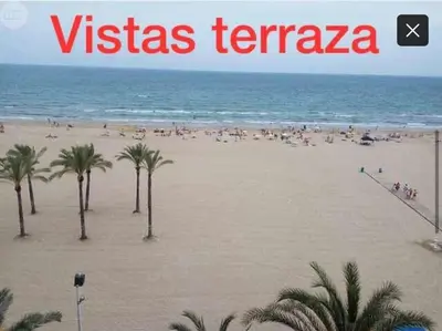 a view of a beach with palm trees and the words vissas terapa at Vistas espectaculares 