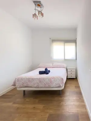 a bedroom with a bed and a window at Apartamento Los Narcisos 2 in Chulilla