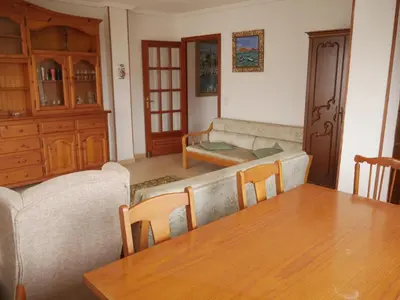 a living room with a table and a couch at EUROMAR, Esc-6, 15-45 in Cullera