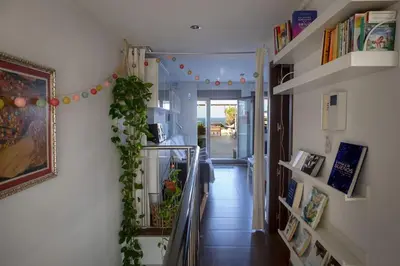 a hallway with a staircase with a plant on the wall at Patacona Sunrises Premium in Valencia