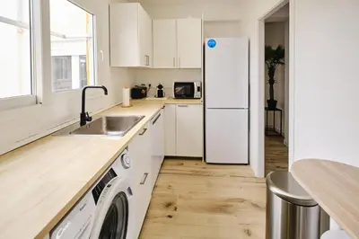 a kitchen with a white refrigerator and a dishwasher at Carmen flat in Valencia