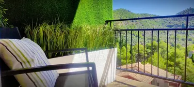 a balcony with a view of a field of trees at Apartamento en la montaña, Serra in Serra